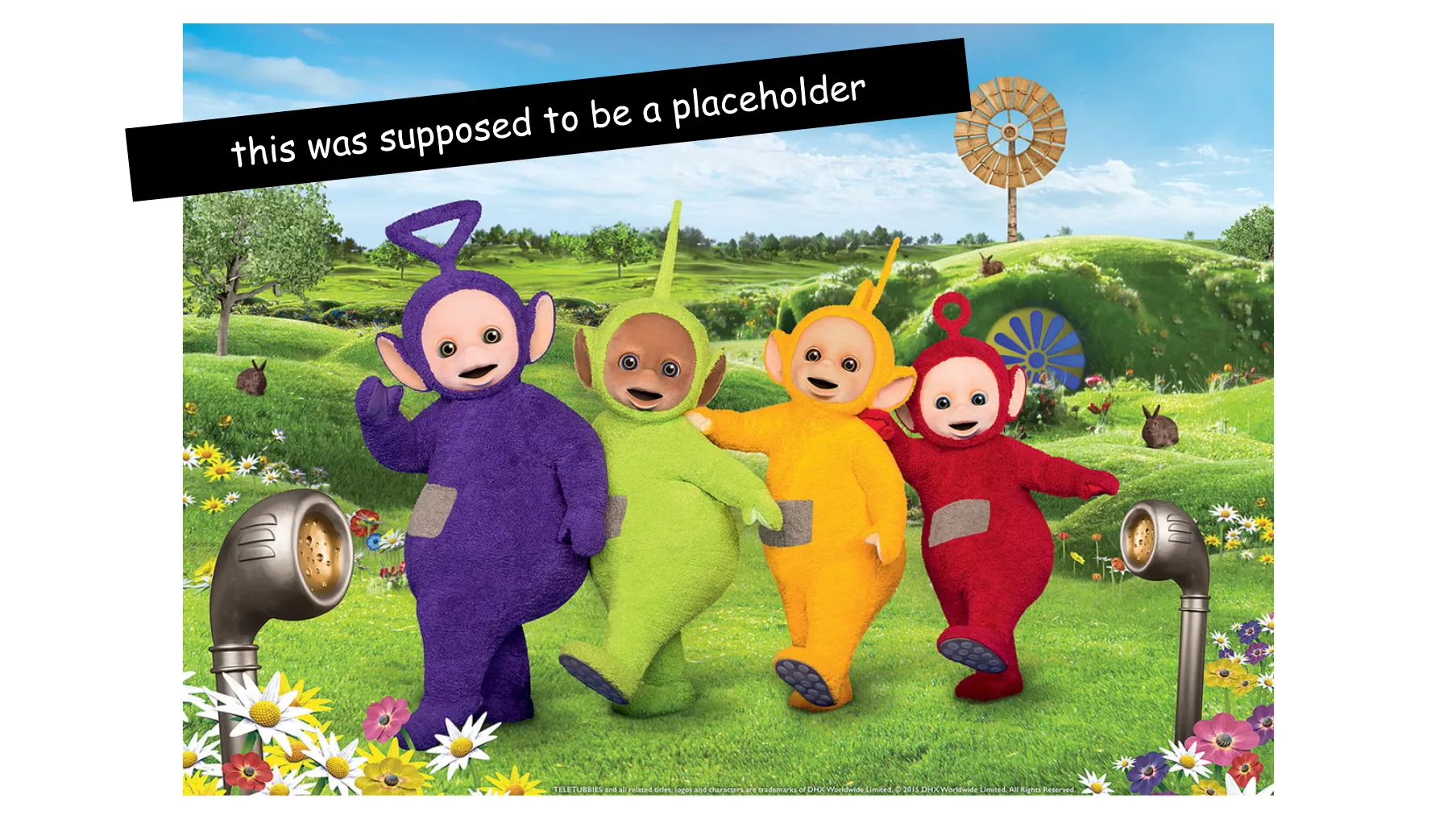 Slide 60. The Teletubbies frolic in the idyllic hills of Teletubbyland. There are flowers and some bunnies, but no Baby Sun at the moment. The slide notes This was supposed to be a placeholder.